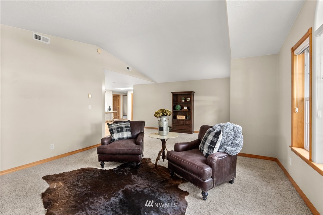 18741 Nutmeg Street Southwest Rochester, WA 98579 - Photo 5 of 39 a living room with furniture rug and window
