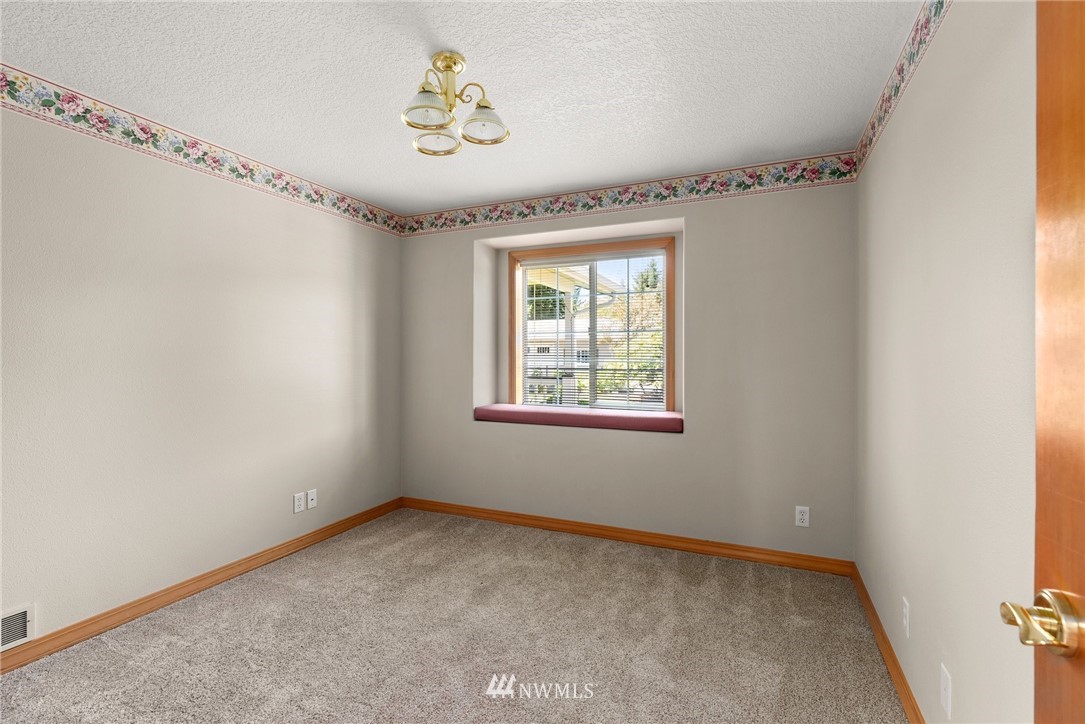 18741 Nutmeg Street Southwest Rochester, WA 98579 - Photo 9 of 39 a view of an empty room with a window