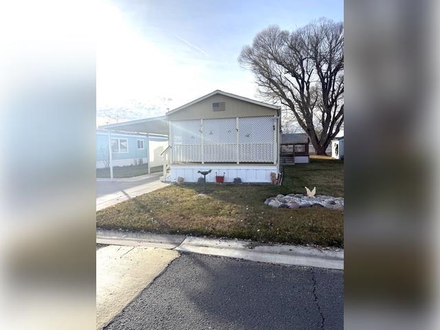 3251 E Road, Unit 11 Clifton, CO 81520 - Photo 1 of 15 a view of a house with a yard