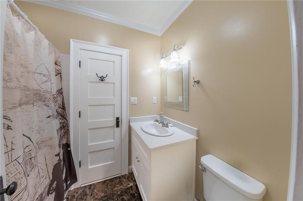 1815 Pickens Street Ball Ground, GA 30107 - Photo 19 of 38 a bathroom with a sink toilet and shower