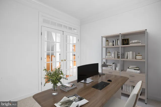 a workspace with furniture and bookshelf