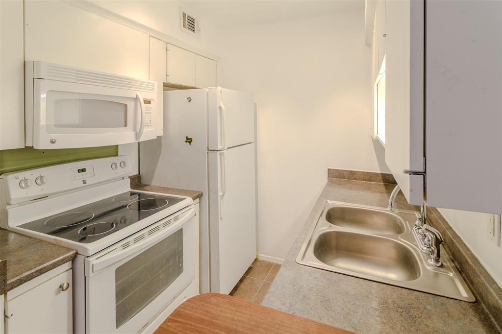 4859 Cedar Springs Road, Unit 234 Dallas, TX 75219 - Photo 23 of 30 a utility room with dryer and washer