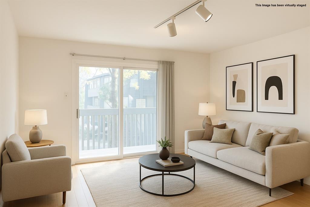 4859 Cedar Springs Road, Unit 234 Dallas, TX 75219 - Photo 5 of 30 a living room with furniture and a large window