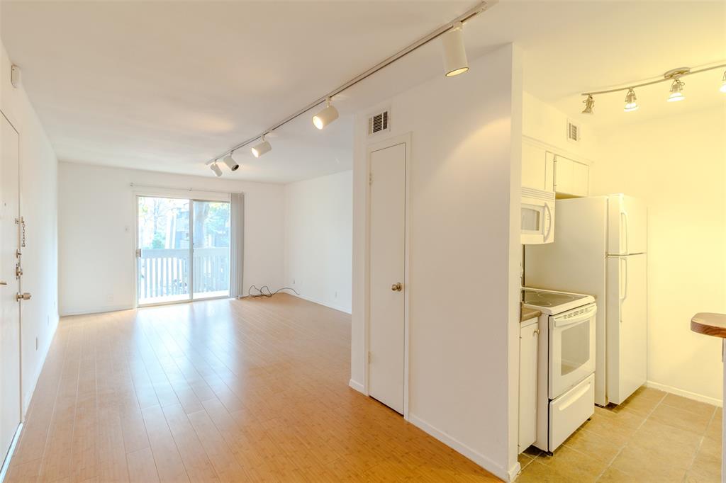 4859 Cedar Springs Road, Unit 234 Dallas, TX 75219 - Photo 7 of 30 a view of an empty room with glass door