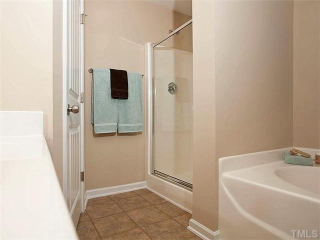 220 Leighann Ridge Lane Rolesville, NC 27571 - Photo 15 of 23 a bathroom with a bathtub and shower