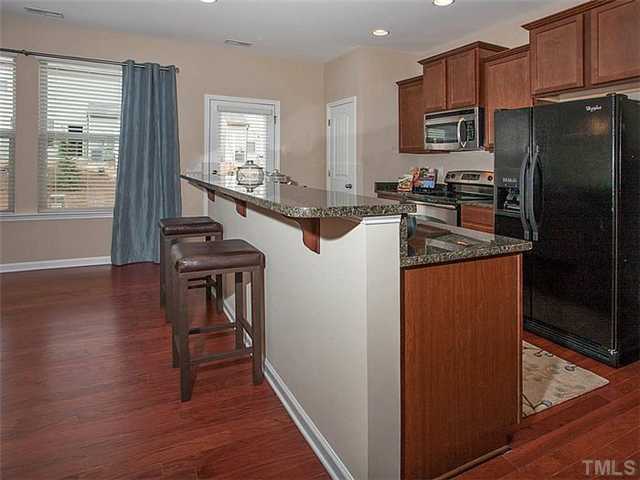 220 Leighann Ridge Lane Rolesville, NC 27571 - Photo 2 of 23 a kitchen with stainless steel appliances granite countertop a refrigerator a stove a sink and a microwave