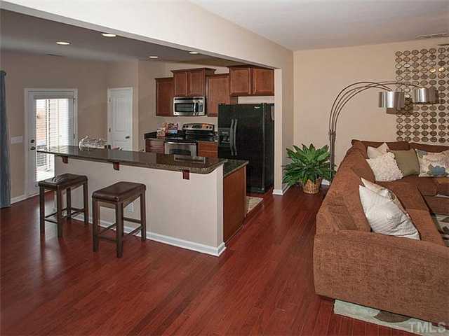 220 Leighann Ridge Lane Rolesville, NC 27571 - Photo 3 of 23 a kitchen with furniture wooden floor and a refrigerator