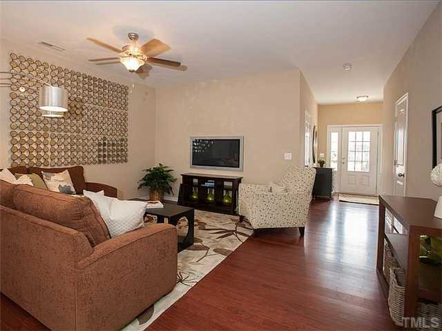 220 Leighann Ridge Lane Rolesville, NC 27571 - Photo 6 of 23 a living room with furniture wooden floor and a flat screen tv