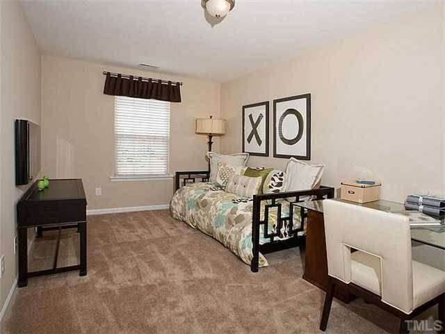 220 Leighann Ridge Lane Rolesville, NC 27571 - Photo 10 of 23 a bedroom with furniture and a window