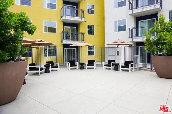 a view of a building with sitting area