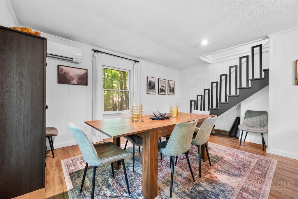 216 Saddle Lane Deep Gap, NC 28618 - Photo 12 of 44 a view of a dining room with furniture and a rug