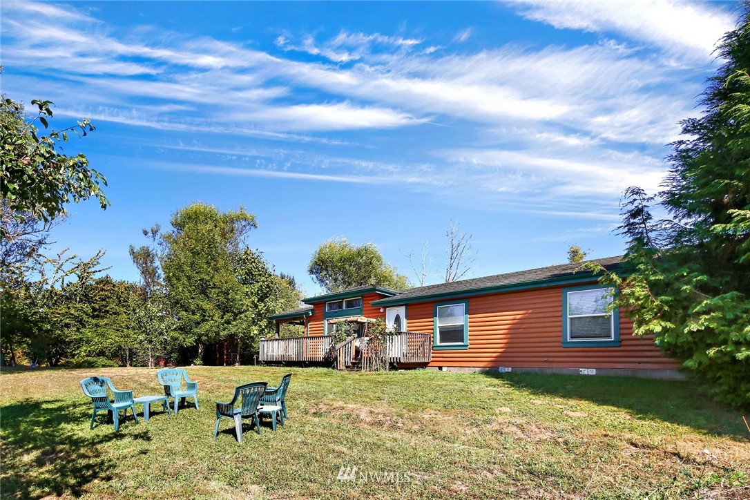 3125 Brown Road Ferndale, WA 98248 - Photo 2 of 24 a backyard of a house with table and chairs