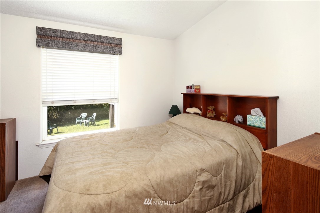 3125 Brown Road Ferndale, WA 98248 - Photo 15 of 24 a bedroom with a bed and a fireplace