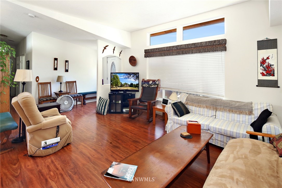 3125 Brown Road Ferndale, WA 98248 - Photo 4 of 24 a living room with furniture a wooden floor and next to a window