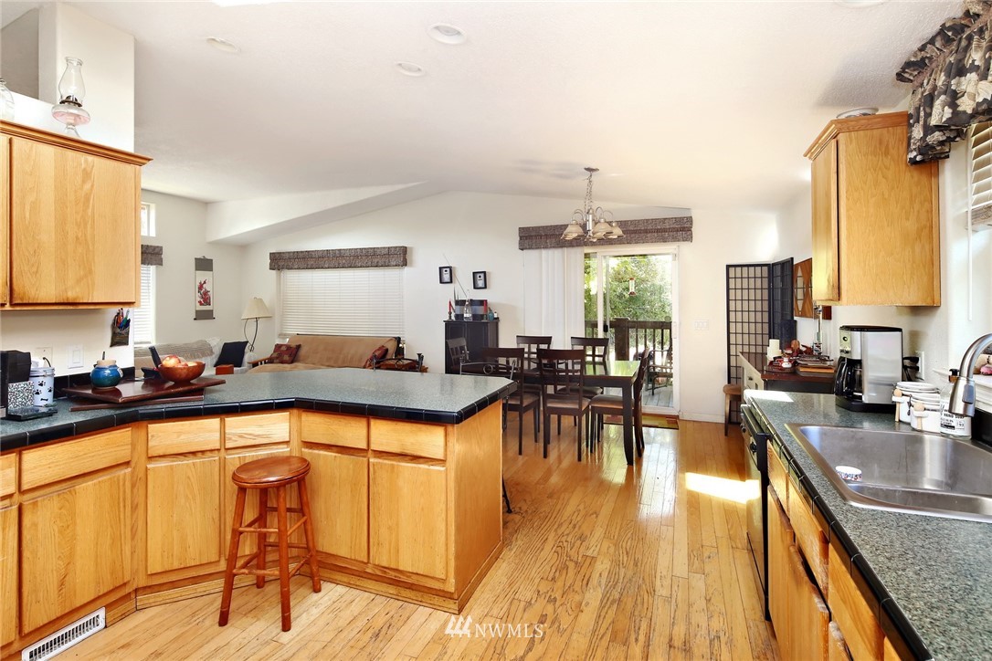 3125 Brown Road Ferndale, WA 98248 - Photo 10 of 24 a large kitchen with a large window and stainless steel appliances