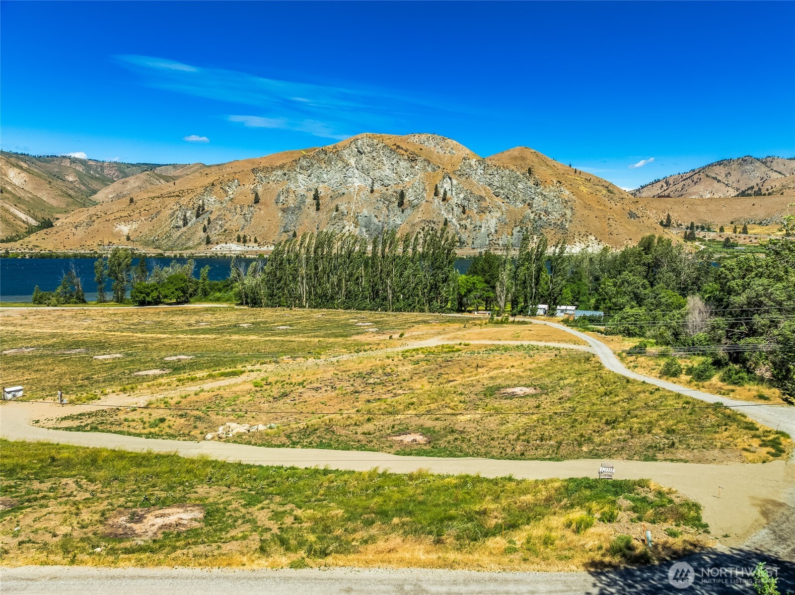 0 Lot 4 Silvest Road Orondo, WA 98843 - Photo 6 of 23 a view of a swimming pool with an ocean in the background
