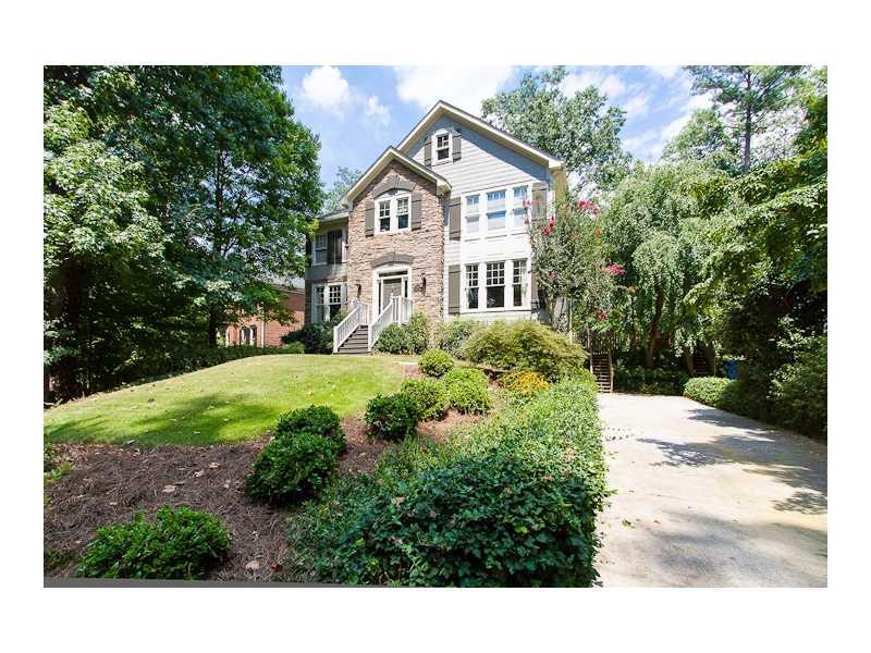 2555 Ridgewood Road Northwest Atlanta, GA 30318 - Photo 1 of 1 a front view of a house with a yard