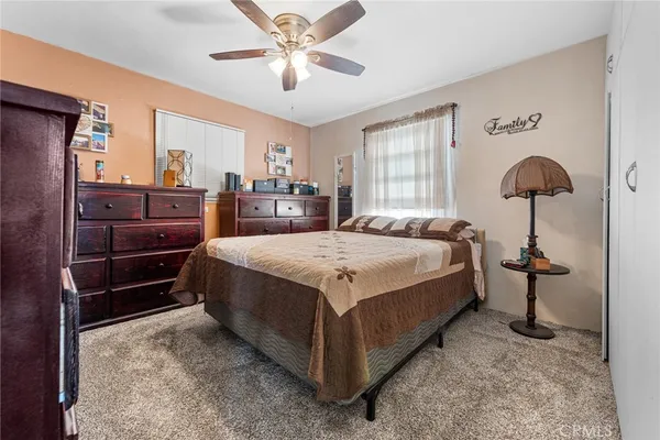 a bed room with a bed and a chandelier