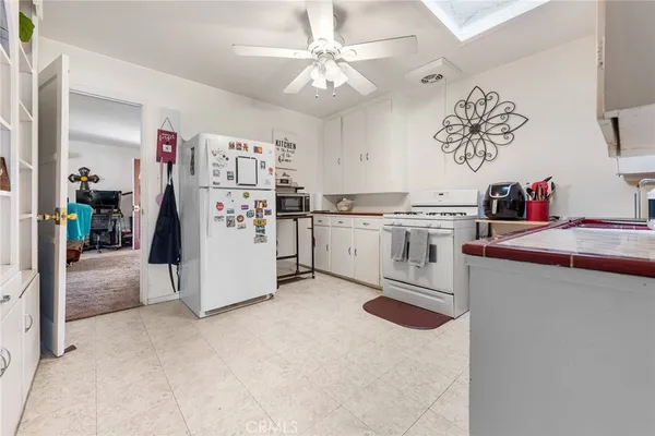 a kitchen with stainless steel appliances granite countertop a stove and a refrigerator