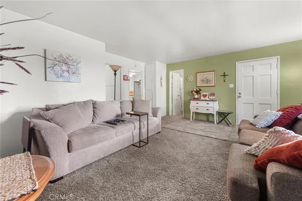 a living room with furniture and a table