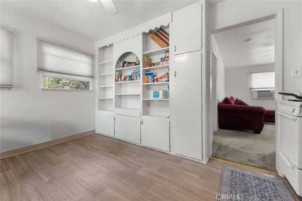 a room with furniture and a book shelf
