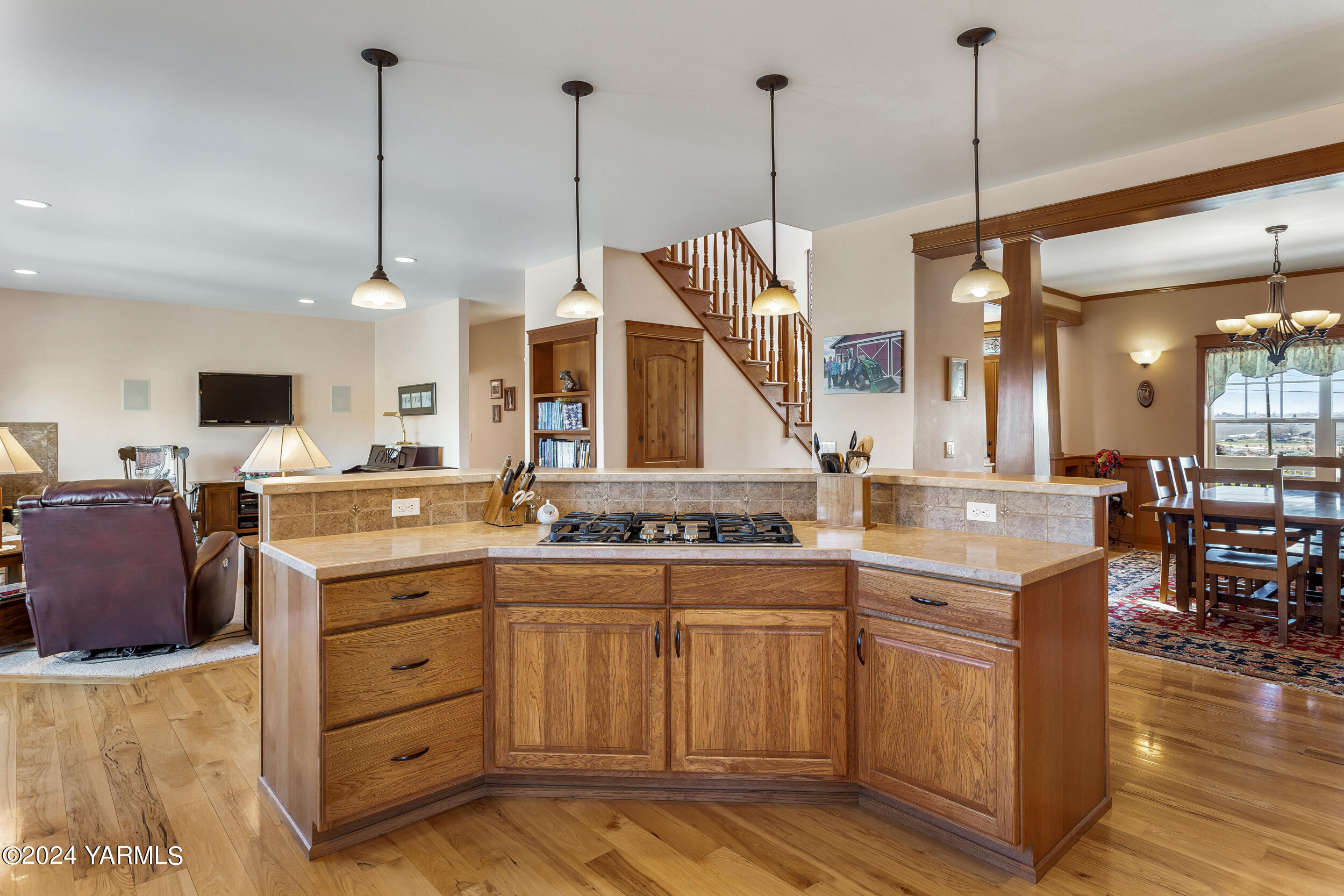 12401 Summitview Ext Road Yakima, WA 98908 - Photo 37 of 63 a open kitchen with stainless steel appliances granite countertop a stove a sink dishwasher and a wooden cabinets with wooden floor