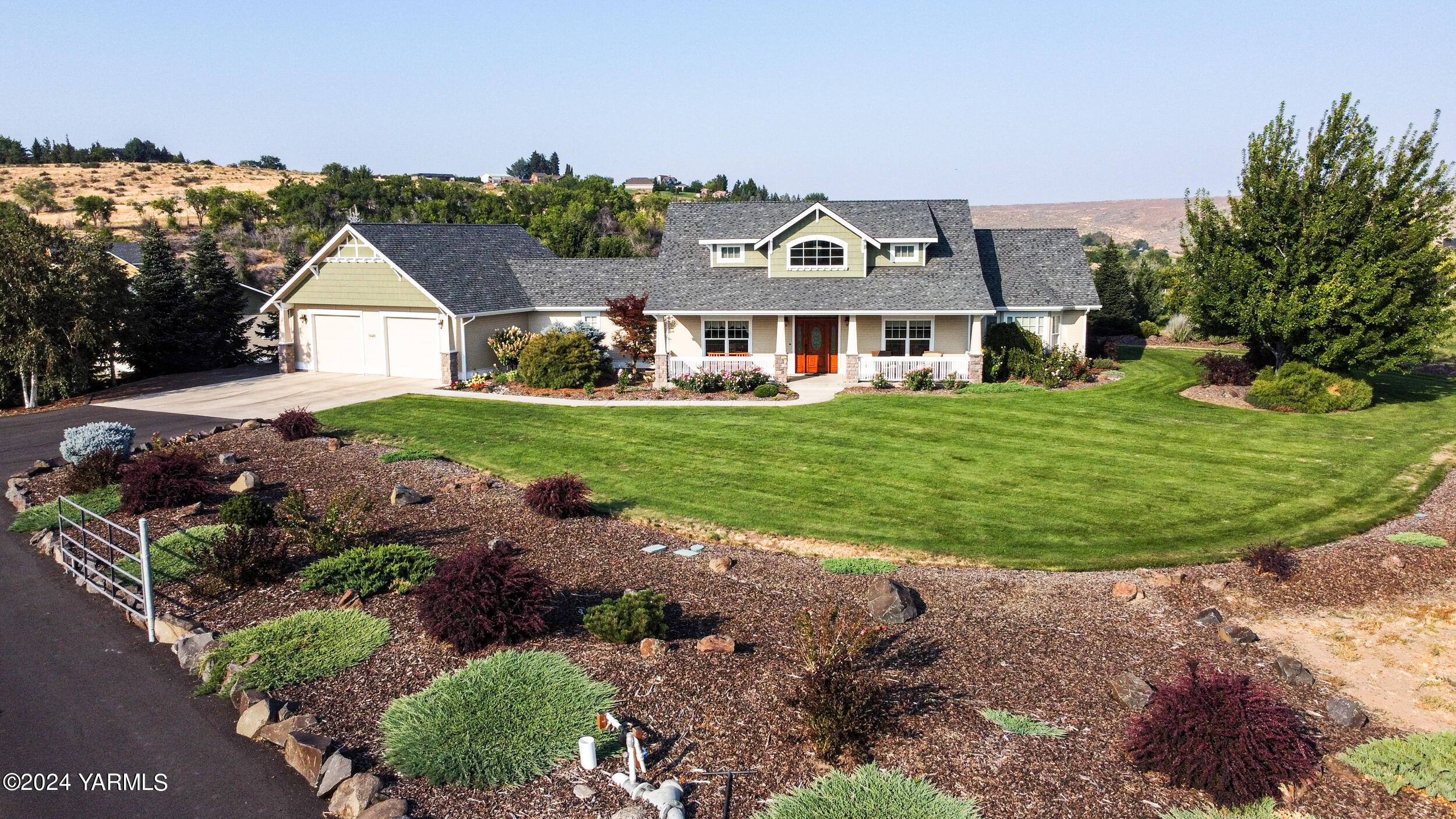 12401 Summitview Ext Road Yakima, WA 98908 - Photo 5 of 63 a front view of a house with a yard and potted plants