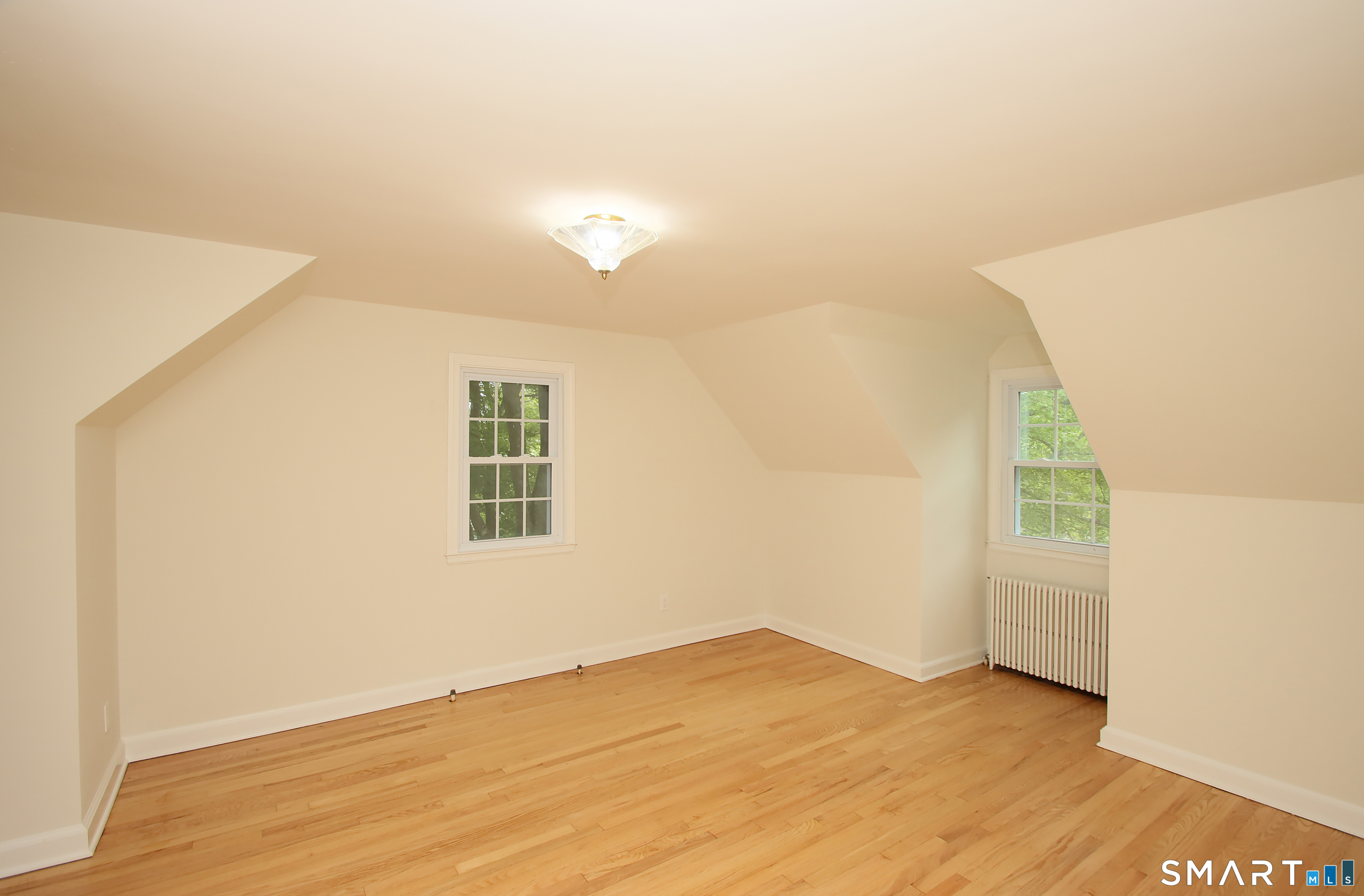 23 Norway Road North Haven, CT 06473 - Photo 24 of 32 an empty room with wooden floor and windows