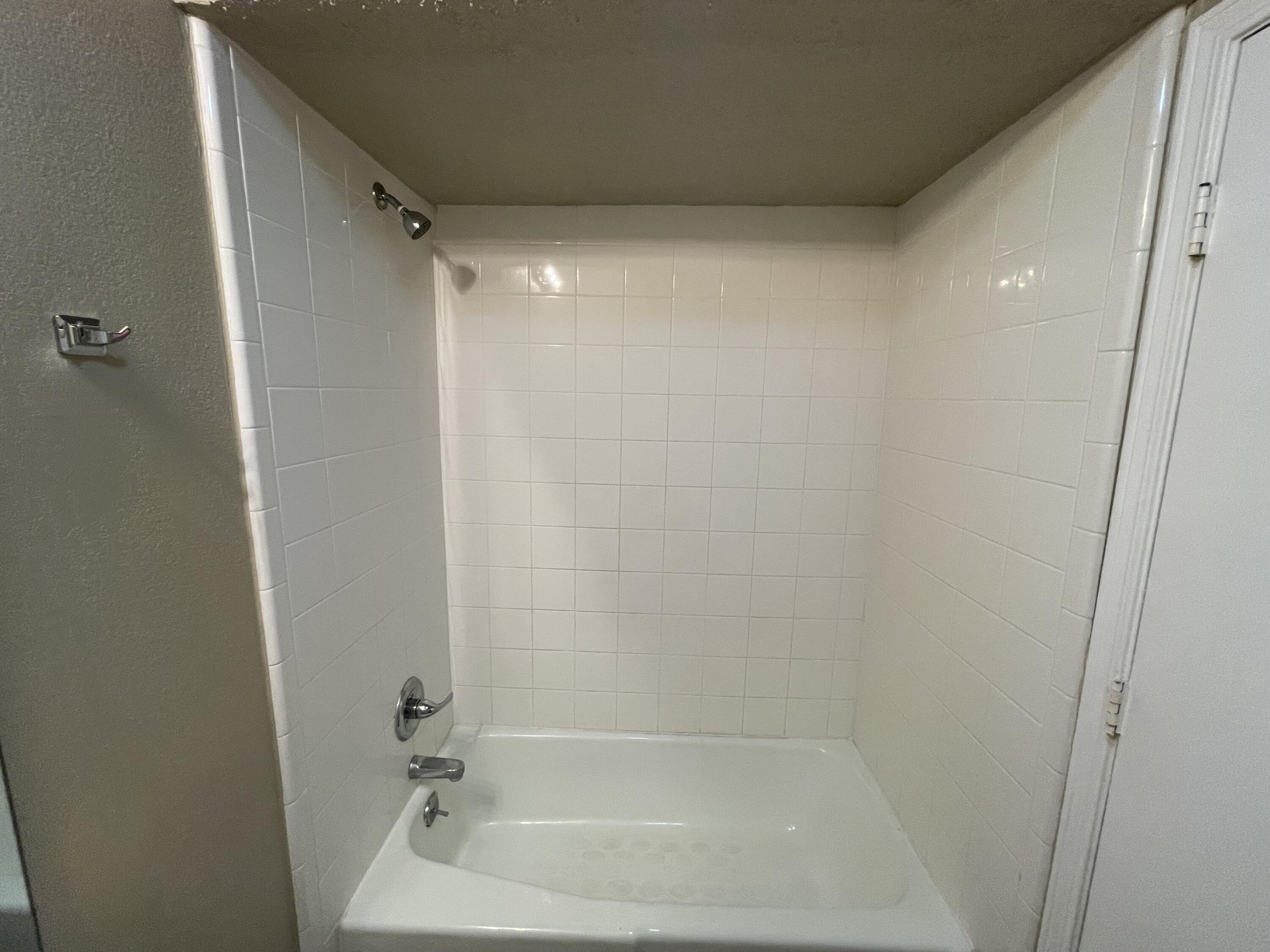 4413 75th Drive, Unit B Lubbock, TX 79424 - Photo 9 of 9 a bathroom with a bathtub