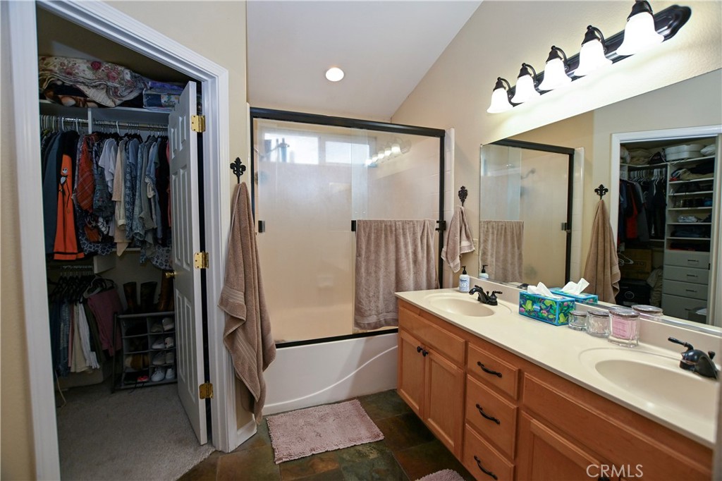 1422 Ridgebrook Way Chico, CA 95928 - Photo 16 of 25 a bathroom with a double vanity sink and a mirror