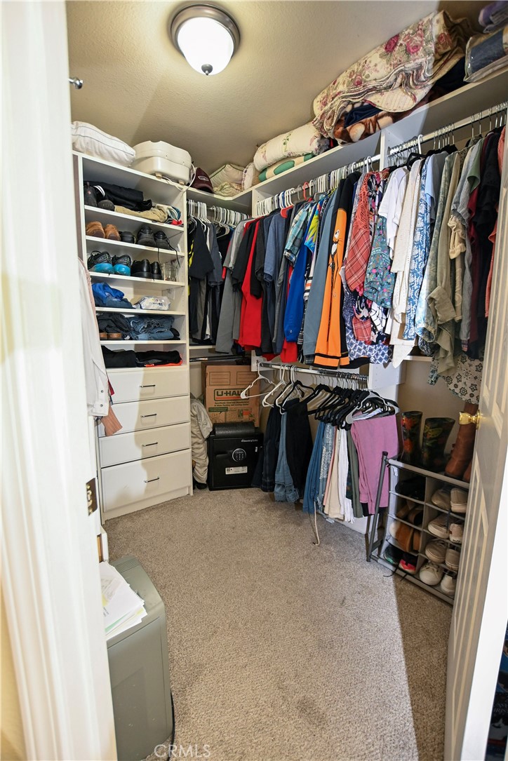 1422 Ridgebrook Way Chico, CA 95928 - Photo 17 of 25 a view of walk in closet with clothes and shoes