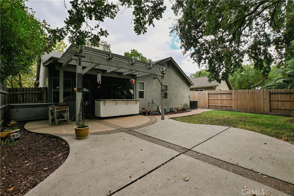 1422 Ridgebrook Way Chico, CA 95928 - Photo 20 of 25 a view of a house with backyard and trees