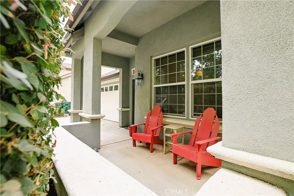1422 Ridgebrook Way Chico, CA 95928 - Photo 2 of 25 a chair and table in front of a house