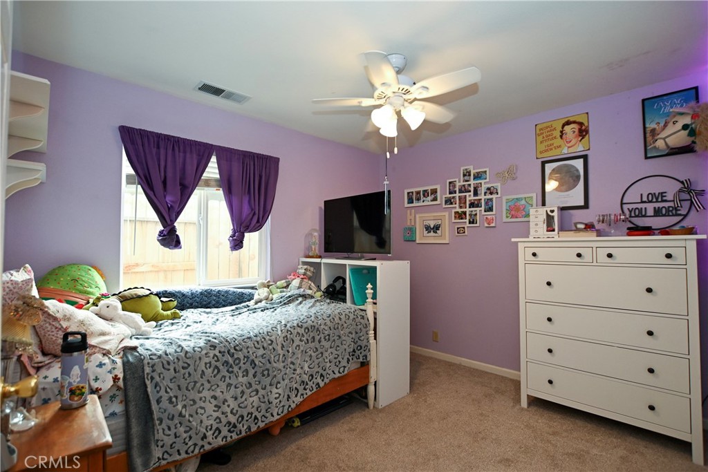 1422 Ridgebrook Way Chico, CA 95928 - Photo 10 of 25 a bedroom with a bed and a flat screen tv