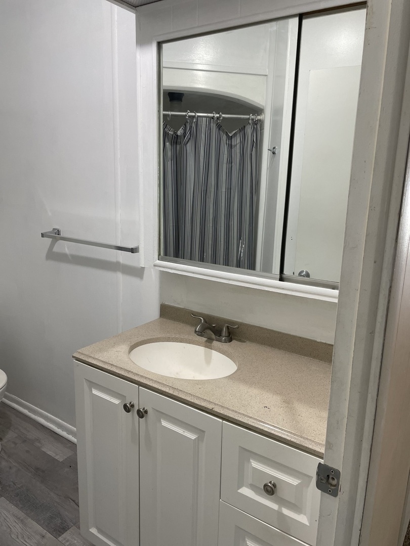 237 Parkwood Road Elgin, IL 60123 - Photo 14 of 15 a bathroom with a sink and a mirror