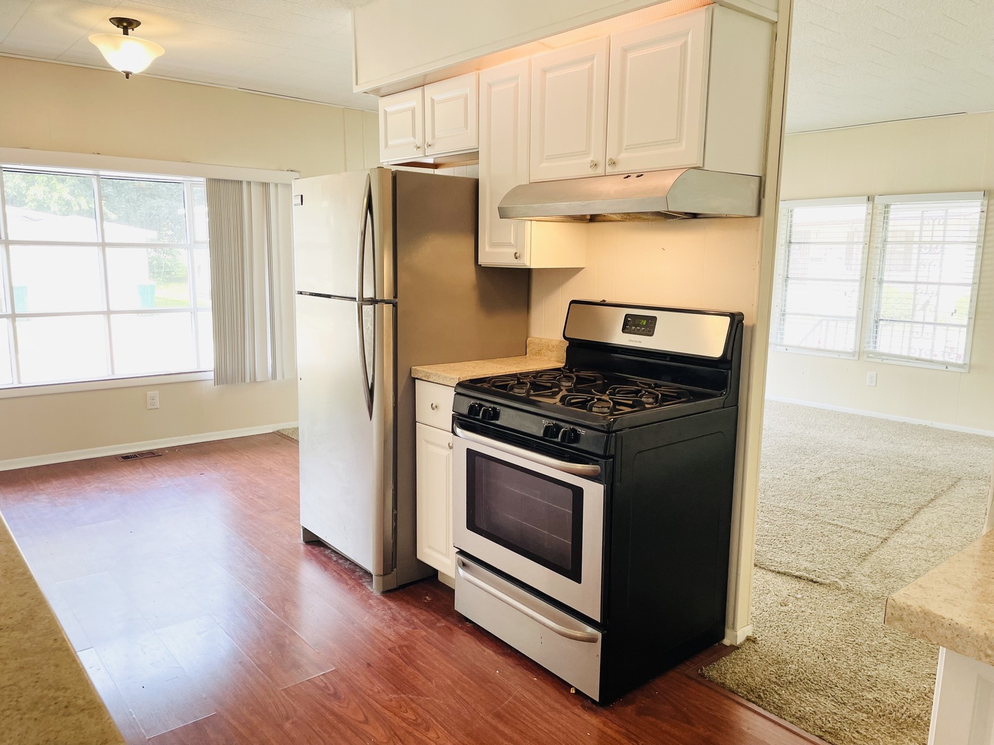 237 Parkwood Road Elgin, IL 60123 - Photo 8 of 15 a kitchen with granite countertop white cabinets and stainless steel appliances