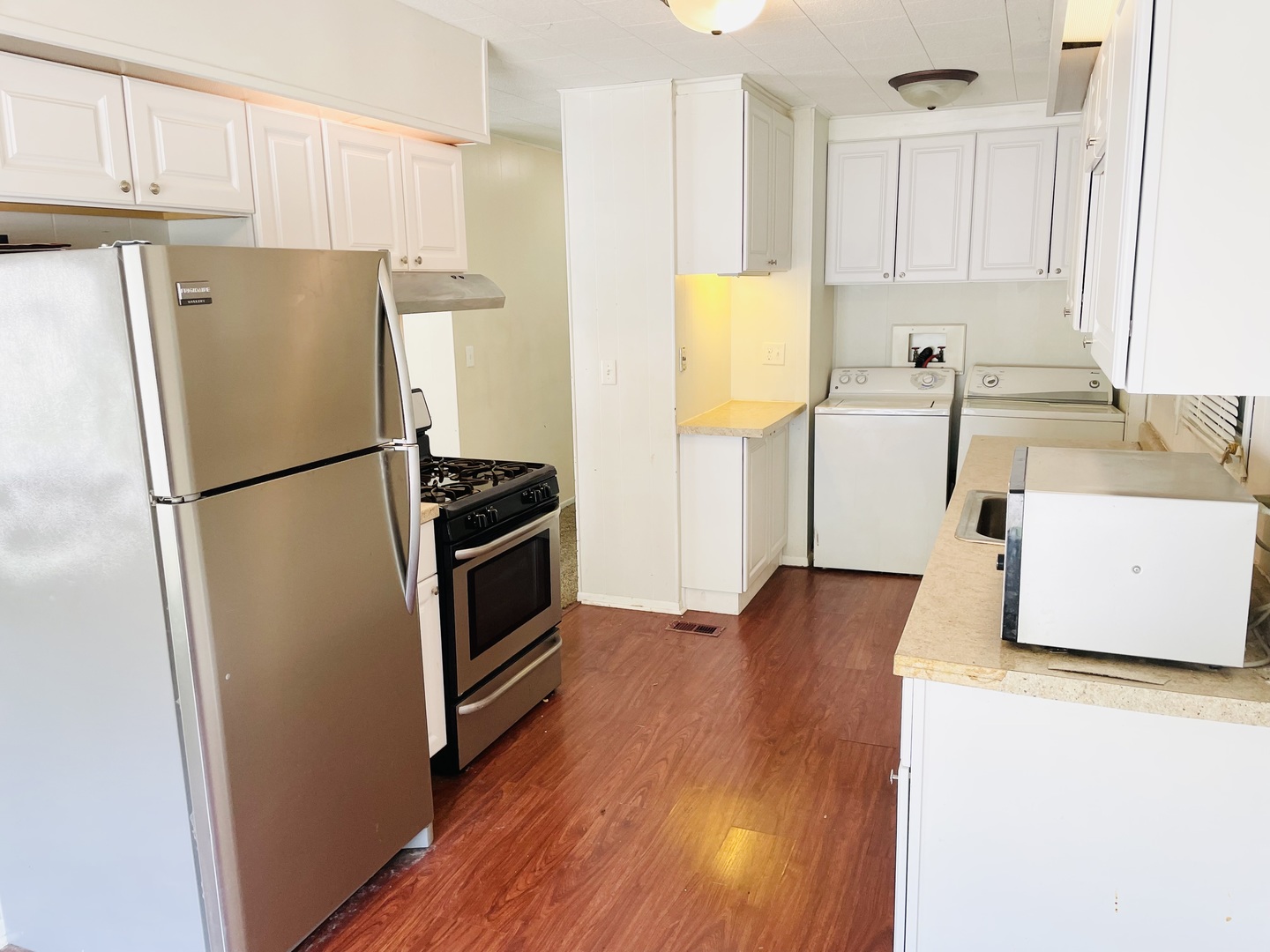 237 Parkwood Road Elgin, IL 60123 - Photo 9 of 15 a kitchen with a refrigerator and a sink
