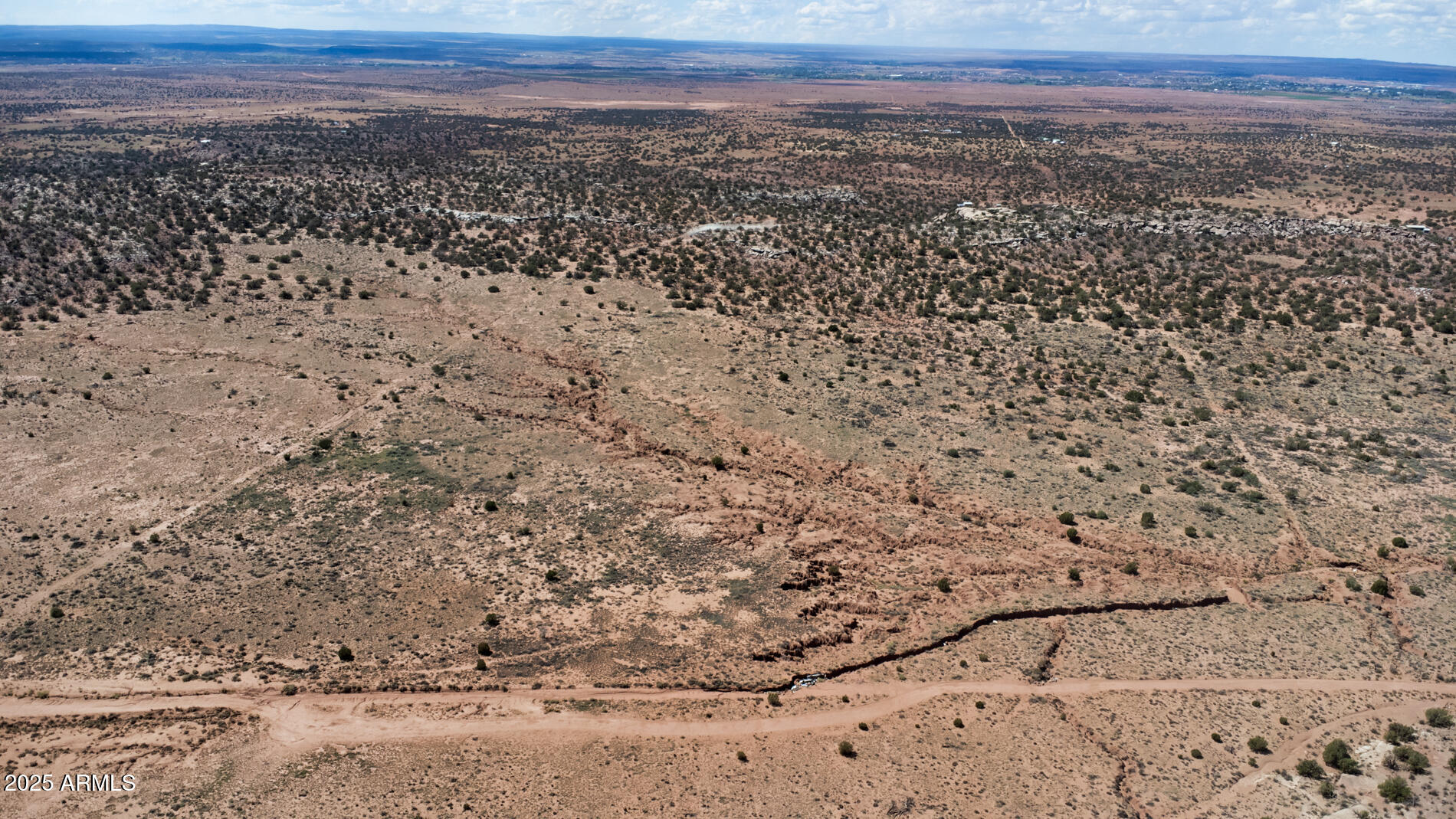 3744 Jordan Road Snowflake, AZ 85937 - Photo 11 of 12 a view of a dry yard with wooden floor and a yard
