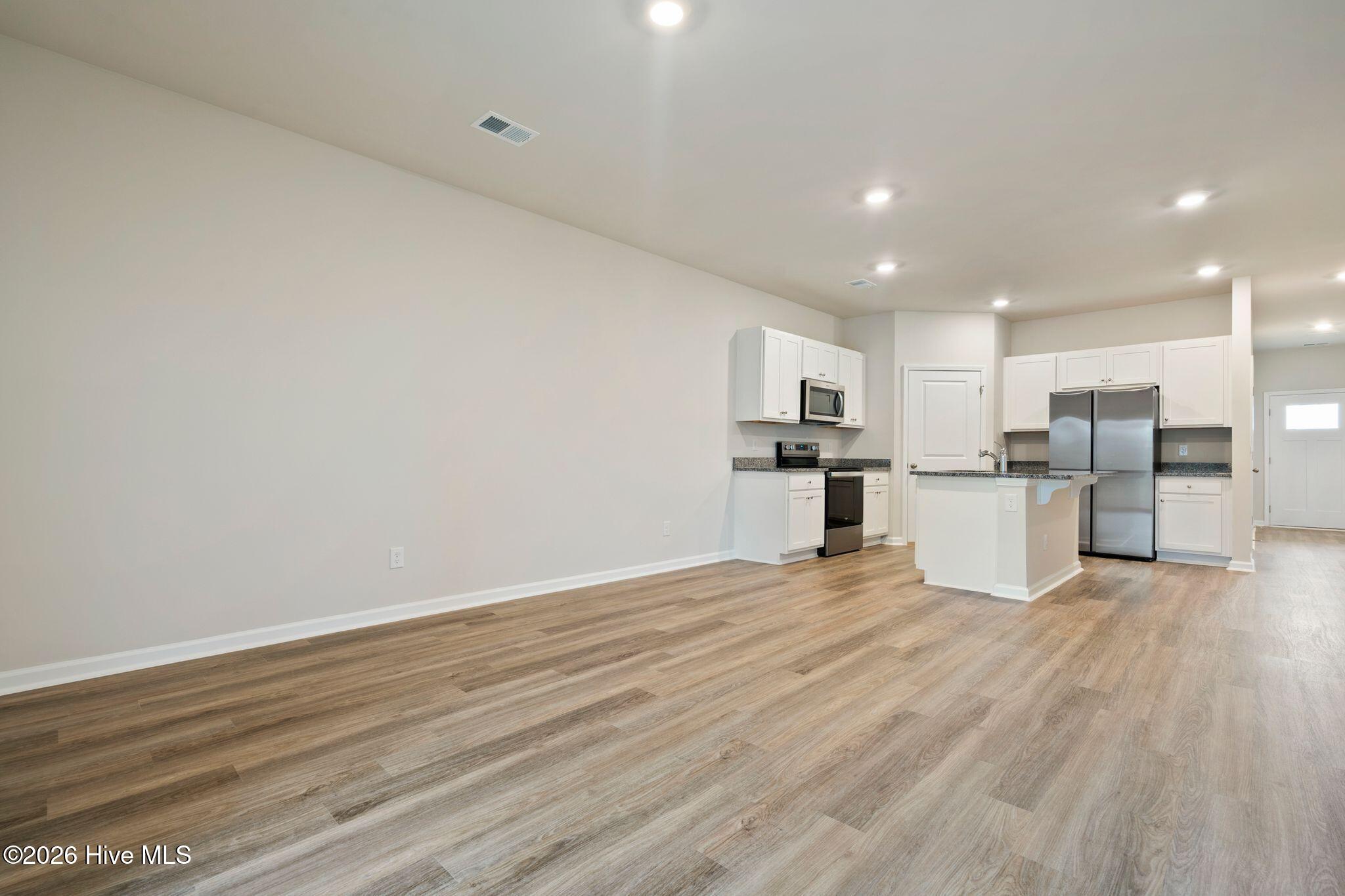 3583 Whaley Way Northwest Ash, NC 28420 - Photo 6 of 38 Living Room/Dining Room