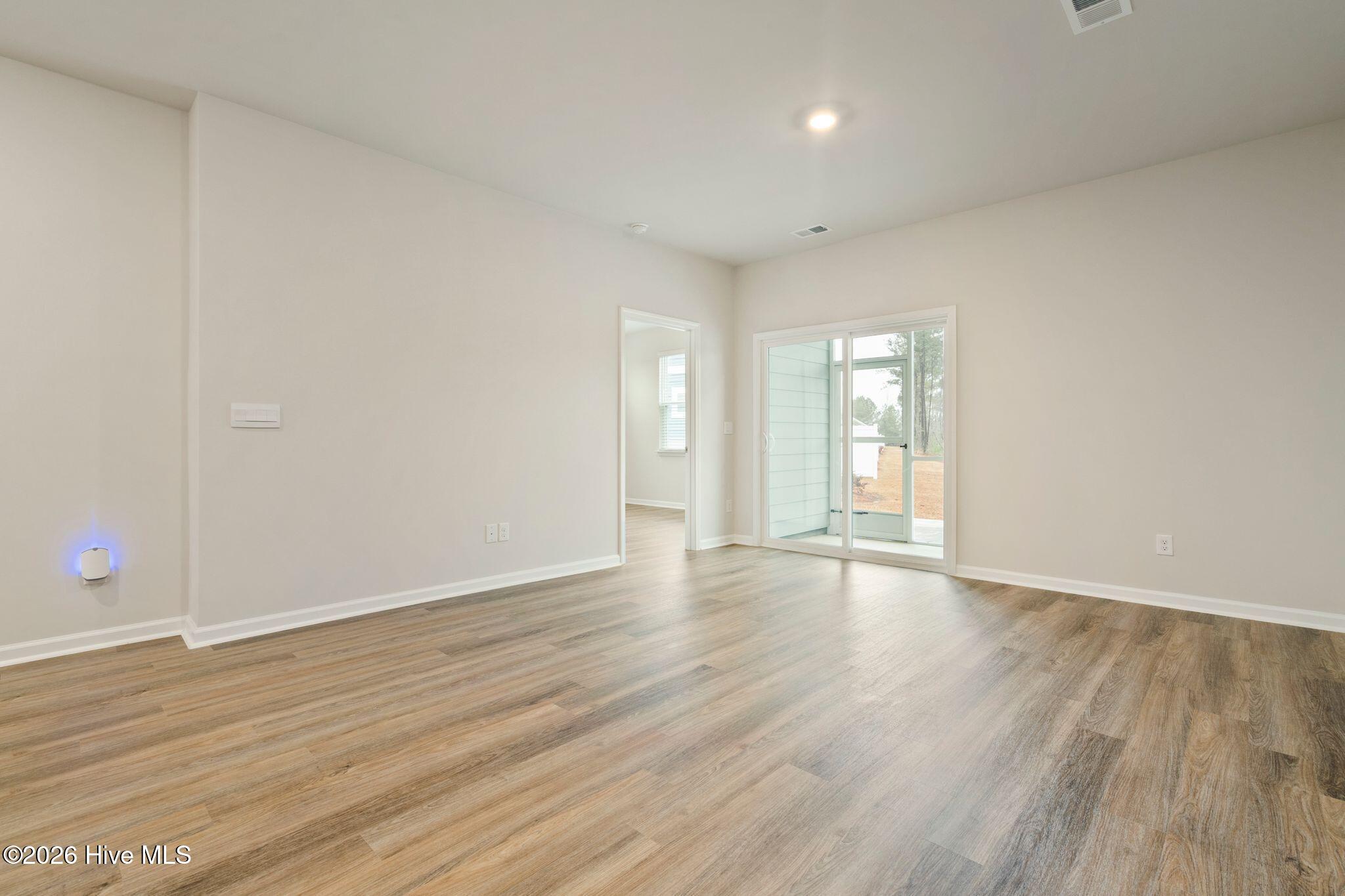 3583 Whaley Way Northwest Ash, NC 28420 - Photo 9 of 38 Living Room to Patio