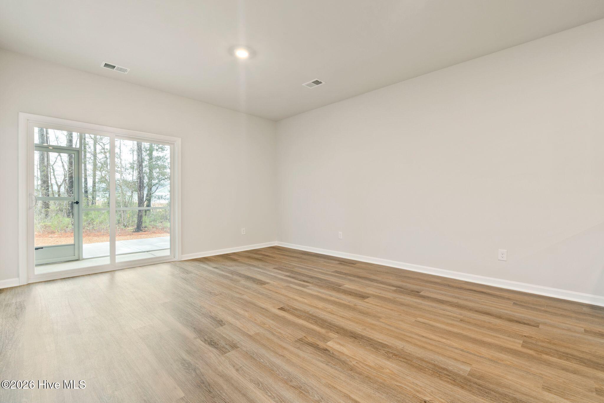 3583 Whaley Way Northwest Ash, NC 28420 - Photo 10 of 38 Living Room to Patio