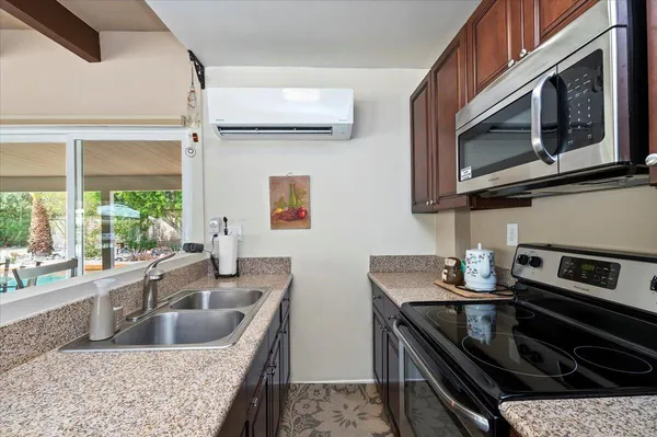 a kitchen with a stove and a microwave