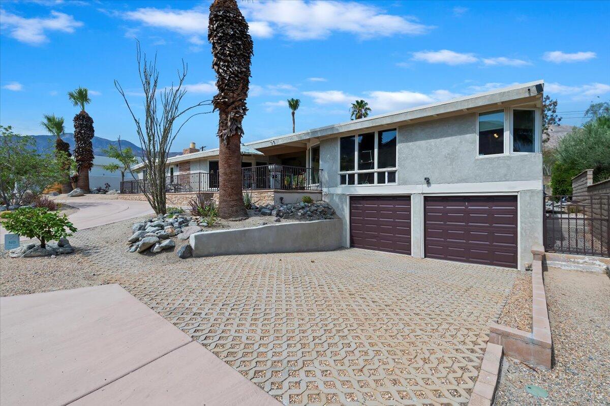 54925 Avenida Ramirez La Quinta, CA 92253 - Photo 2 of 50 a front view of a house with garden