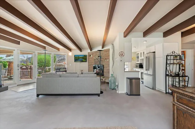 a view of mountain with sunset in background