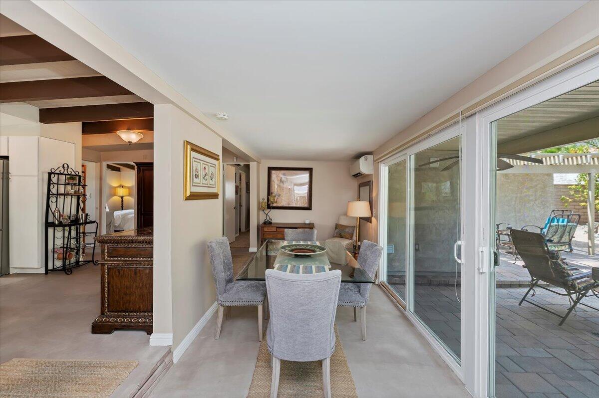 54925 Avenida Ramirez La Quinta, CA 92253 - Photo 26 of 50 a dining room with furniture and wooden floor