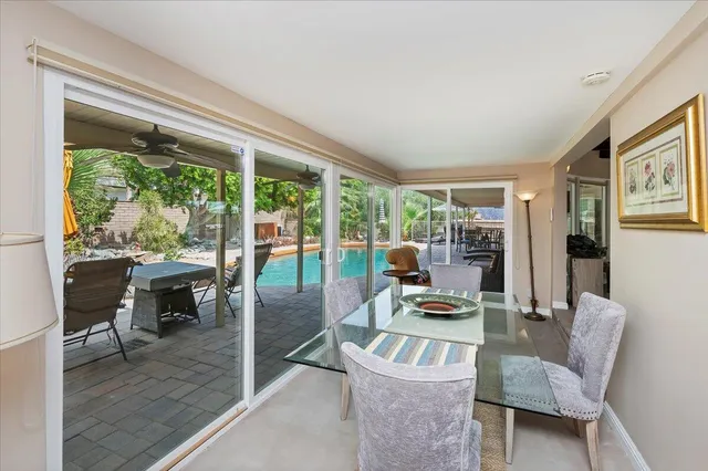 a dining room with furniture and wooden floor