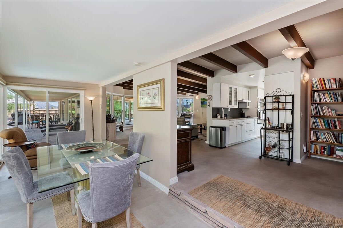 54925 Avenida Ramirez La Quinta, CA 92253 - Photo 28 of 50 a living room with lots of furniture and kitchen view