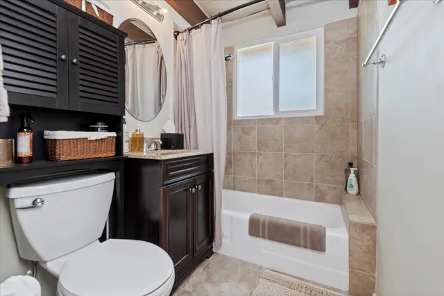 a bedroom with bed and a window