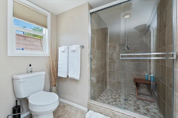 a spacious bathroom with a granite countertop sink mirror and double
