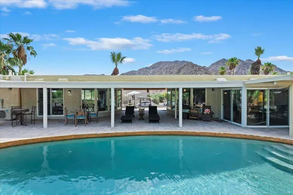 a outdoor dining space with furniture and outdoor view